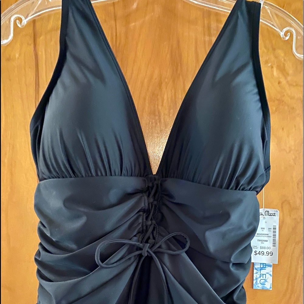 Into the Blue. Black one piece.  Low cut. Sexy
